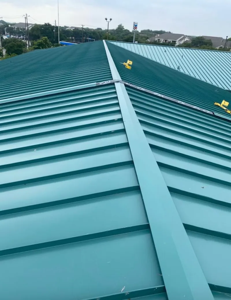 Green commercial metal roof ridge and valley for Metal Roof Repair in International Falls
